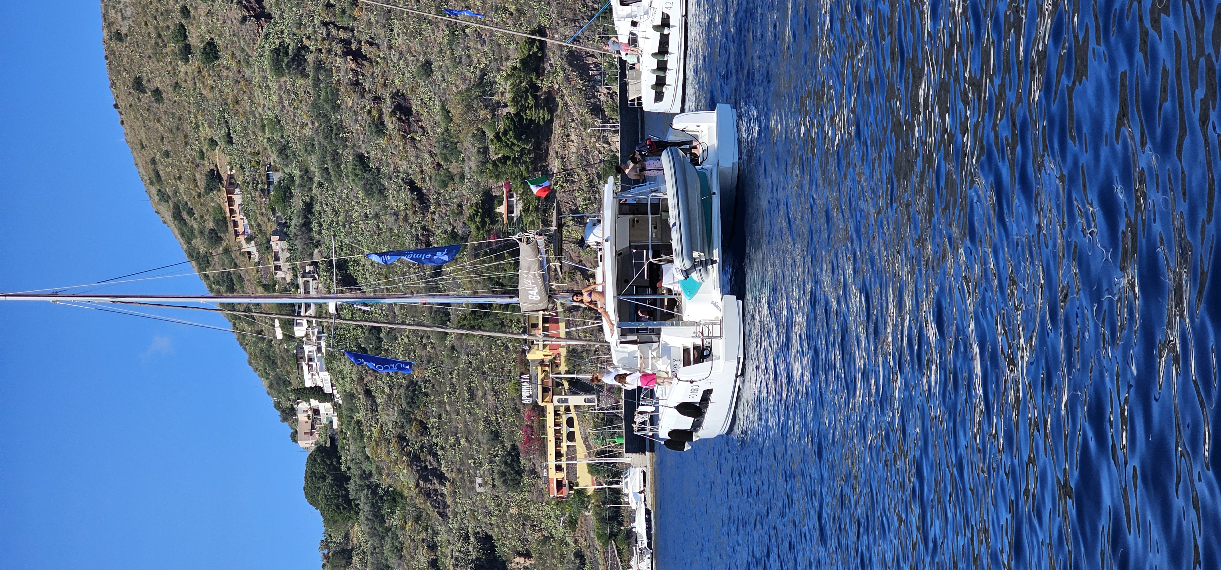 Crystal clear Mediterranean waters during Aeolian Islands sailing trip