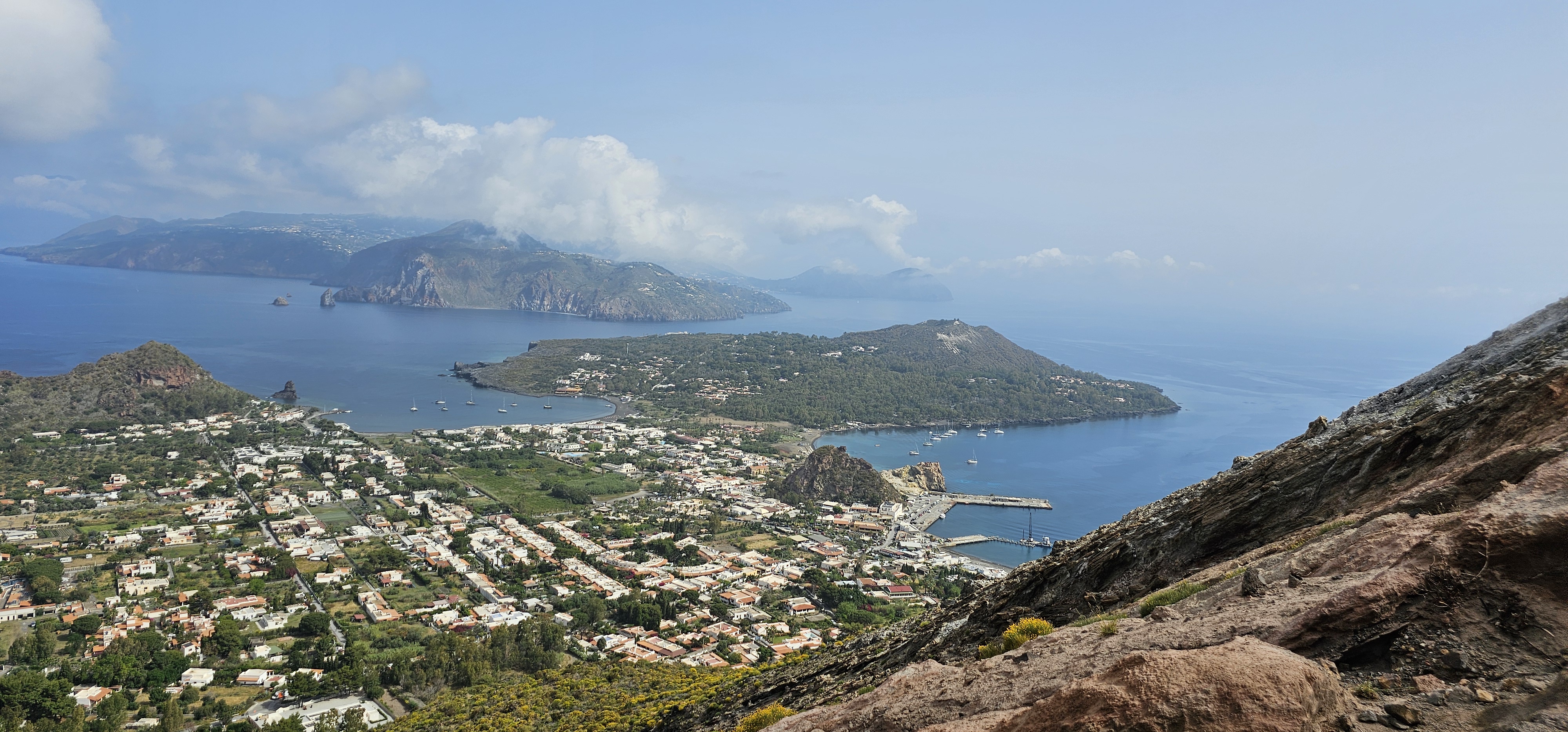 Sailing yacht cruising through blue Mediterranean waters near Sicily coast