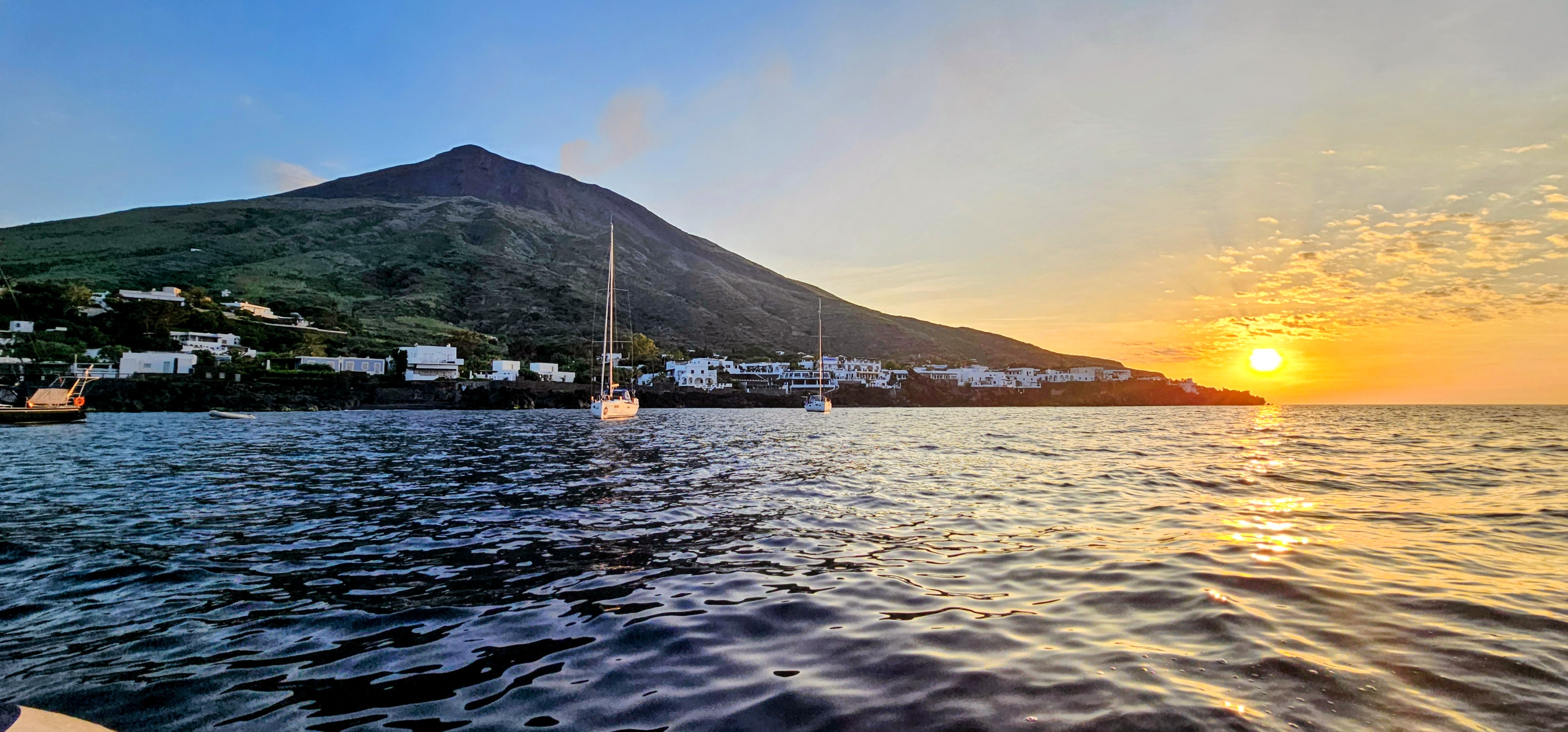 Stromboli active volcano eruption at night with lava flow, Sicily sailing destination